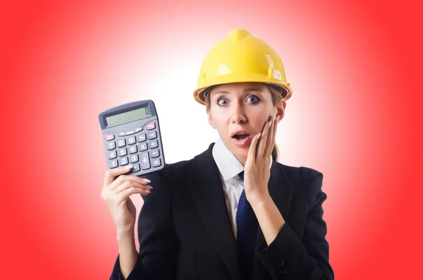 Construction worker with calculator — Stock Photo, Image