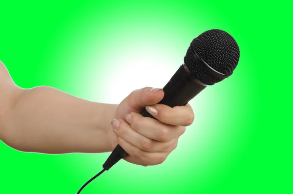 Hand with black microphone — Stock Photo, Image