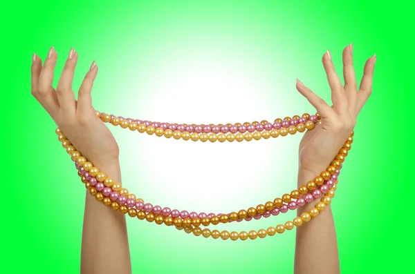 Pearls necklace in hands — Stock Photo, Image