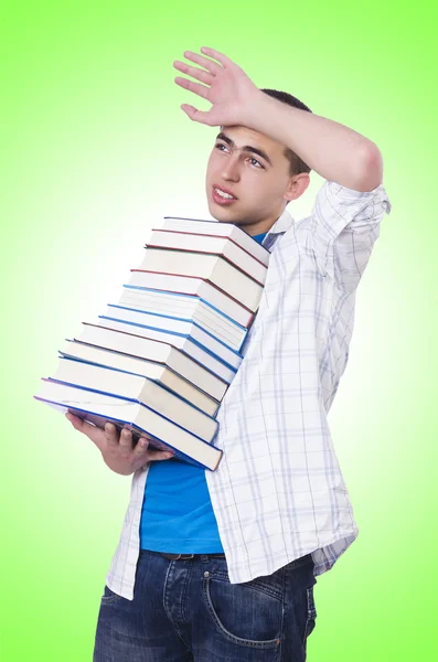 Student with lots of books — ストック写真