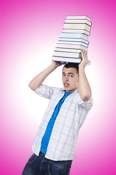 Student mit vielen Büchern — Stockfoto