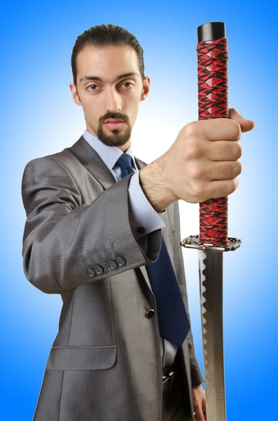 Бизнесмен с мечом — стоковое фото