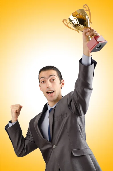 Man being awarded with golden cup Stock Photo