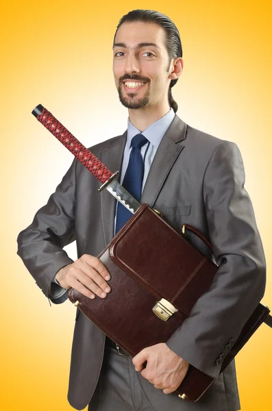 Obchodní muž s mečem — Stock fotografie