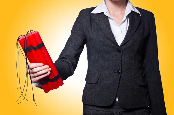 Hand holding bars of dynamite — Stock Photo, Image