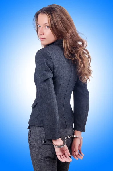 Female businesswoman with handcuffs — Stock Photo, Image