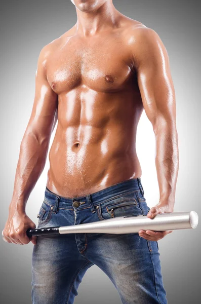 Muscular man with baseball bat — Stock Photo, Image