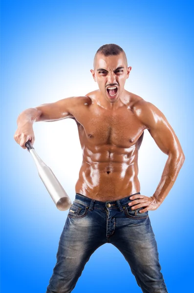 Muscular man with baseball bat — Stock Photo, Image