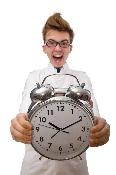 Funny doctor with alarm clock isolated on white — Stock Photo, Image