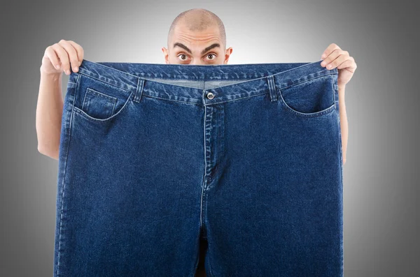 Man with oversized jeans — Stock Photo, Image