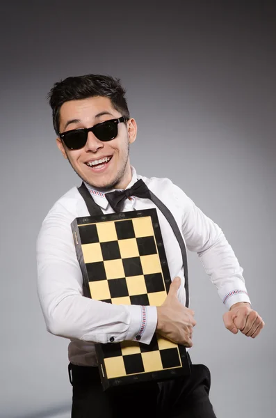 Funny chess player with board — Stock Photo, Image