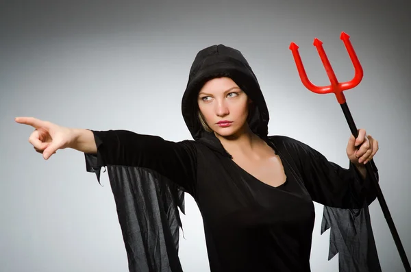 Halloween concept with woman holding pitchfork — Stock Photo, Image