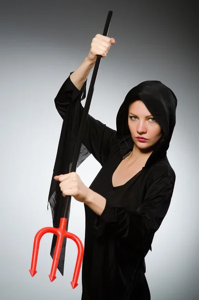 Halloween concept with woman holding pitchfork — Stock Photo, Image