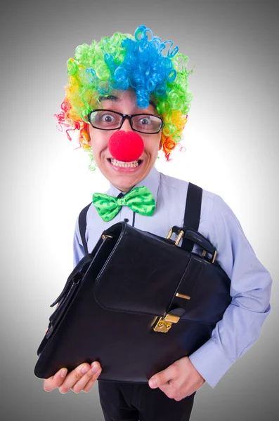 Clown affärsman på grå — Stockfoto