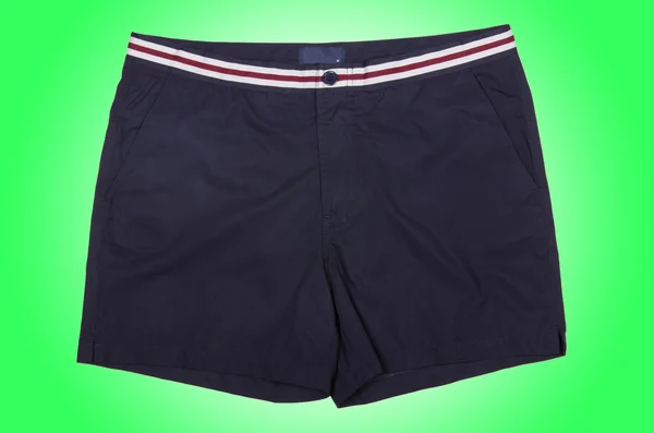 Male shorts  on green — Stock Photo, Image