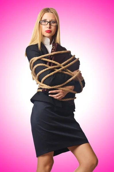 Businesswoman tied up with rope — Stock Photo, Image
