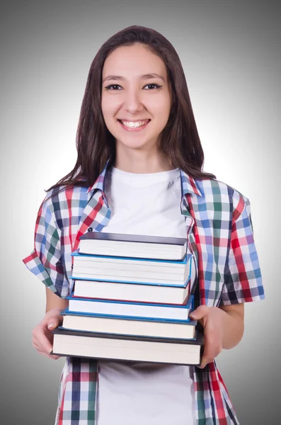 Student tjej med många böcker — Stockfoto