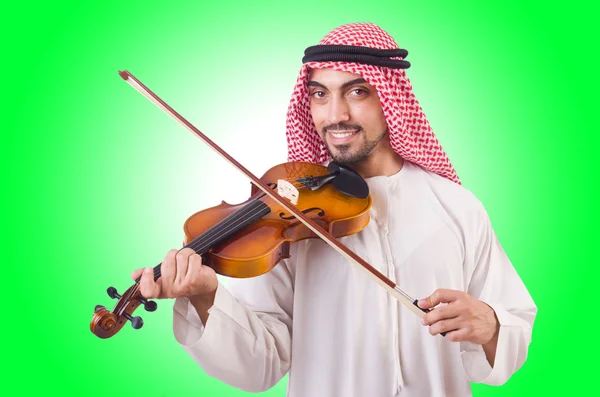 Homem árabe tocando música no branco — Fotografia de Stock