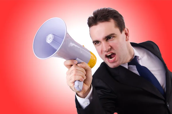 Young businessman with loudspeaker — Stock Photo, Image