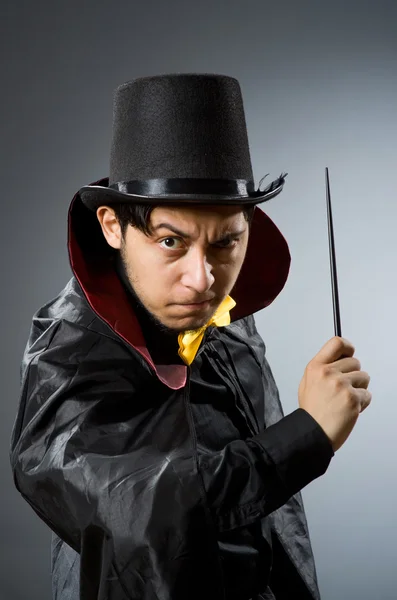 Funny magician man with wand — Stock fotografie