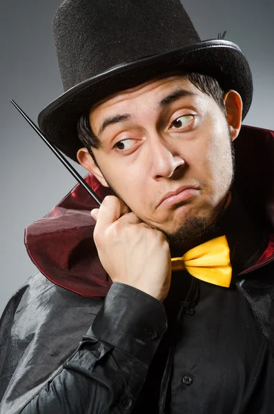 Funny magician man with wand — Stockfoto