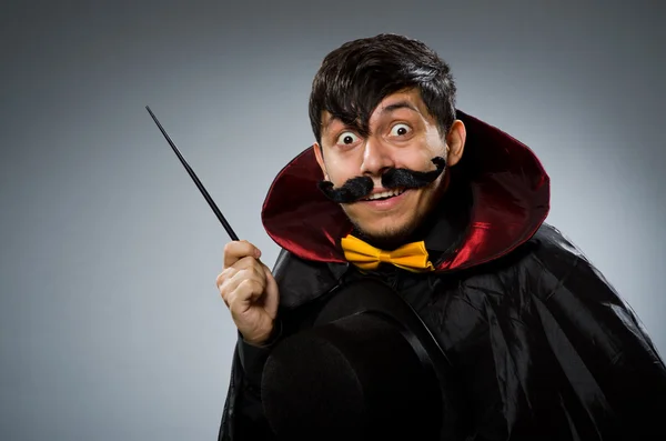 Funny magician man with wand — Stockfoto