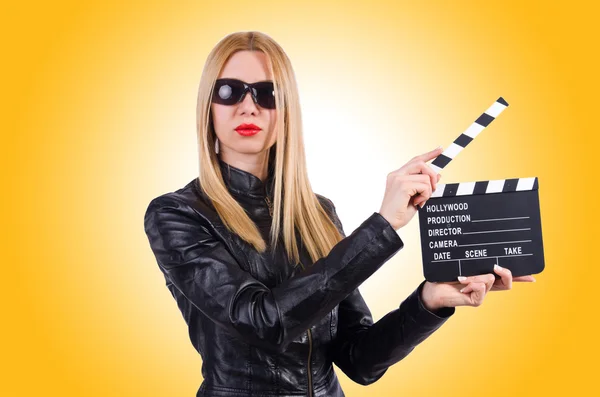 Woman with movie clapper — Stock Photo, Image