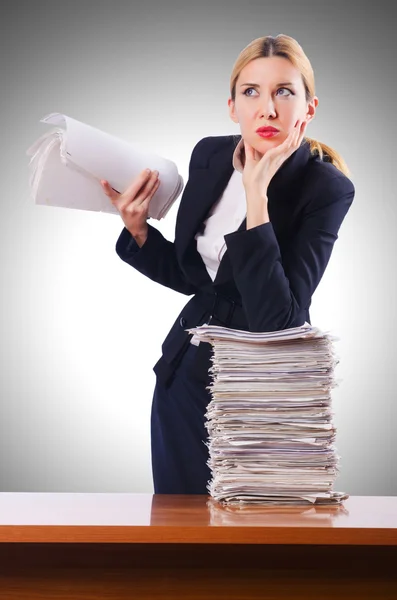 Businesswoman with lots of papers — Stock Photo, Image