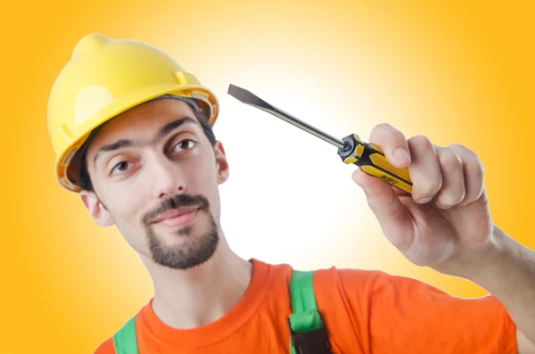 Repairman in coveralls in industrial concept — Stock Photo, Image