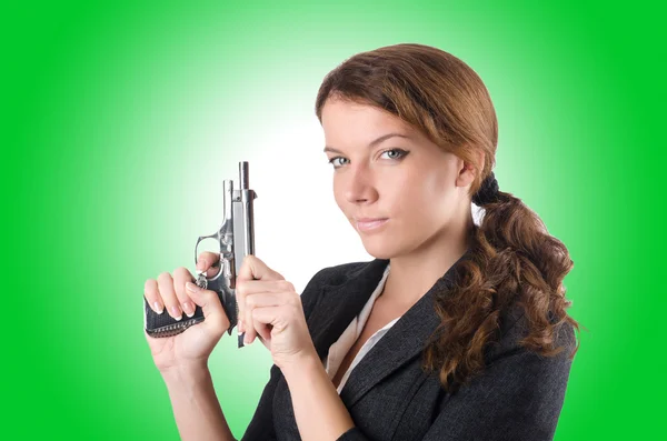 Woman business woman with hand gun — Stockfoto