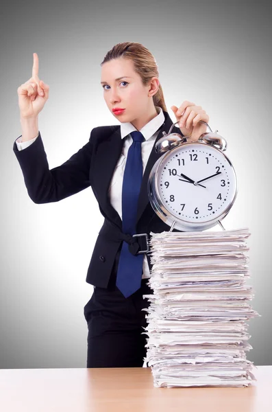 Businesswoman with clock and papers — Stock Photo, Image