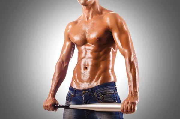 Muscular man with baseball bat — Stock Photo, Image