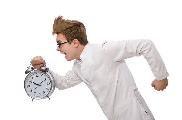 Médico engraçado com despertador isolado em branco — Fotografia de Stock