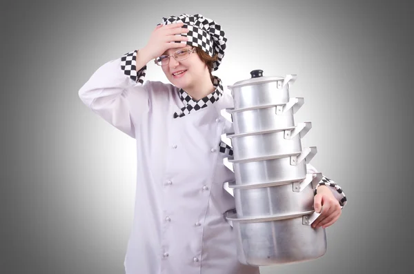 Cook with stack of pots — Stock Photo, Image