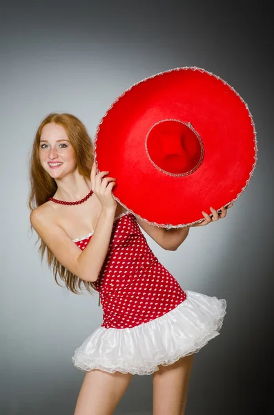 Woman wearing red sombrero hat — Stock Photo, Image