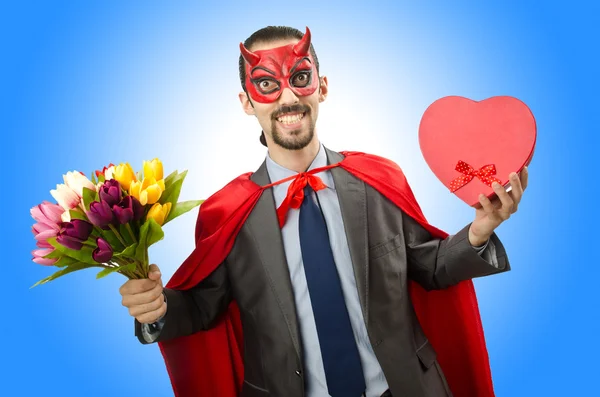 Superman with flowers and heart — Stock Photo, Image