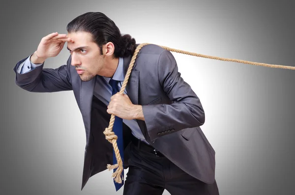 Businessman pulling rope — Stock Photo, Image