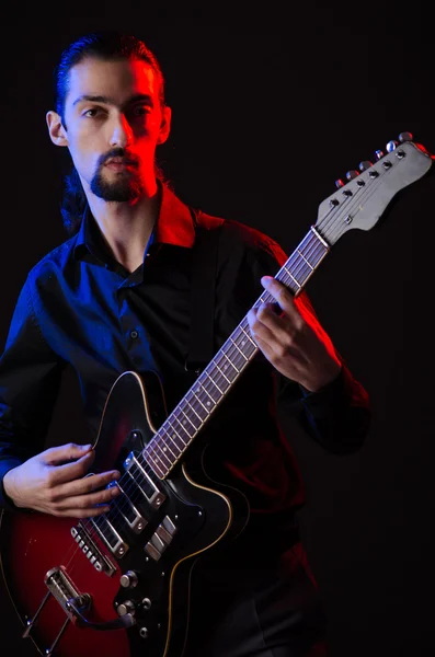 Man with guitar during concert — Stock Photo, Image