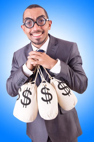 Man met zakken geld. — Stockfoto