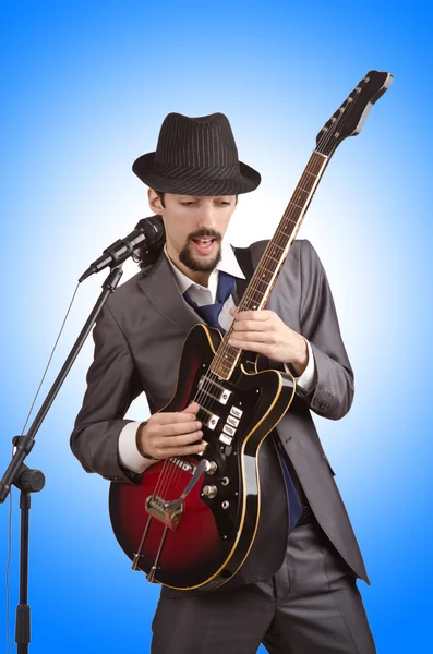 Businessman playing the guitar — Stock Photo, Image