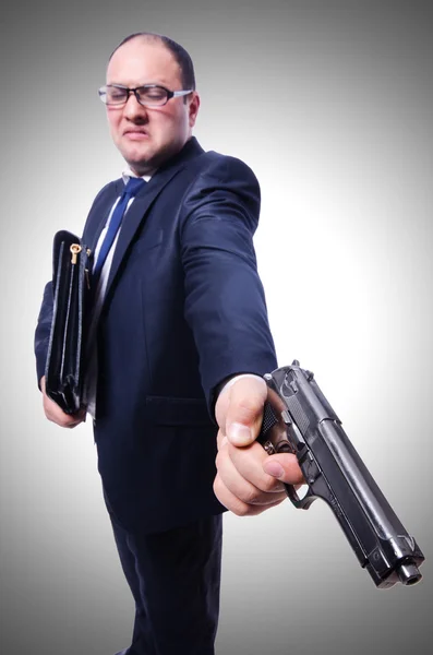 Бизнесмен с ружьем — стоковое фото