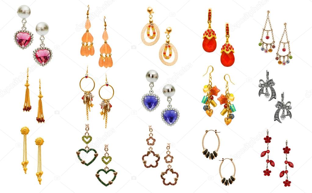 Set of various earrings isolated on white