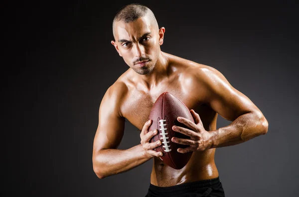 Muscular football player — Stock Photo, Image