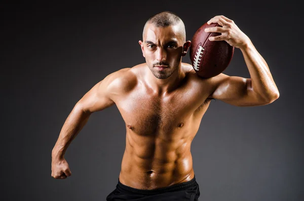 Muscular football player — Stock Photo, Image