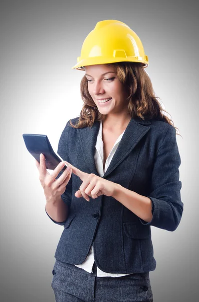 Female builder with calculator — Stock Photo, Image