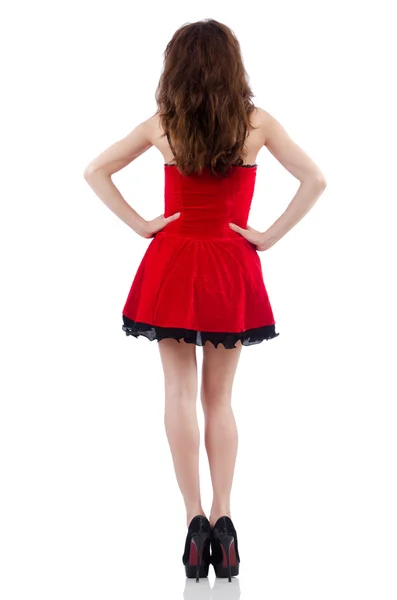 Mladá žena model pózuje v červených mini šaty — Stock fotografie