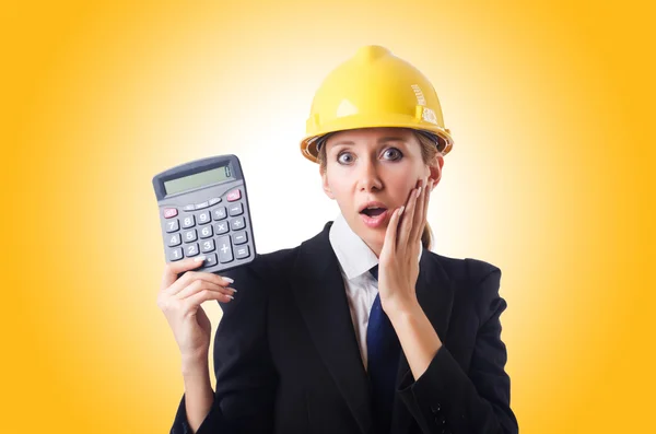 Construction worker with calculator — Stock Photo, Image