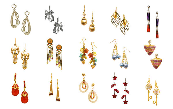Set of various earrings isolated on white