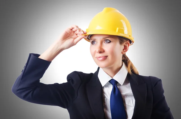 Businesswoman with hard hat Stock Photo