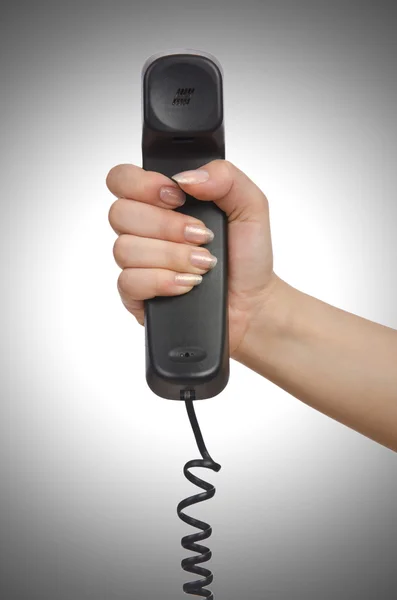 Hand with landline phone — Stock Photo, Image